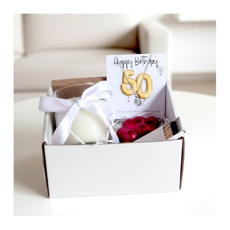 50th birthday hamper with a necklace, candle and chocolate hearts