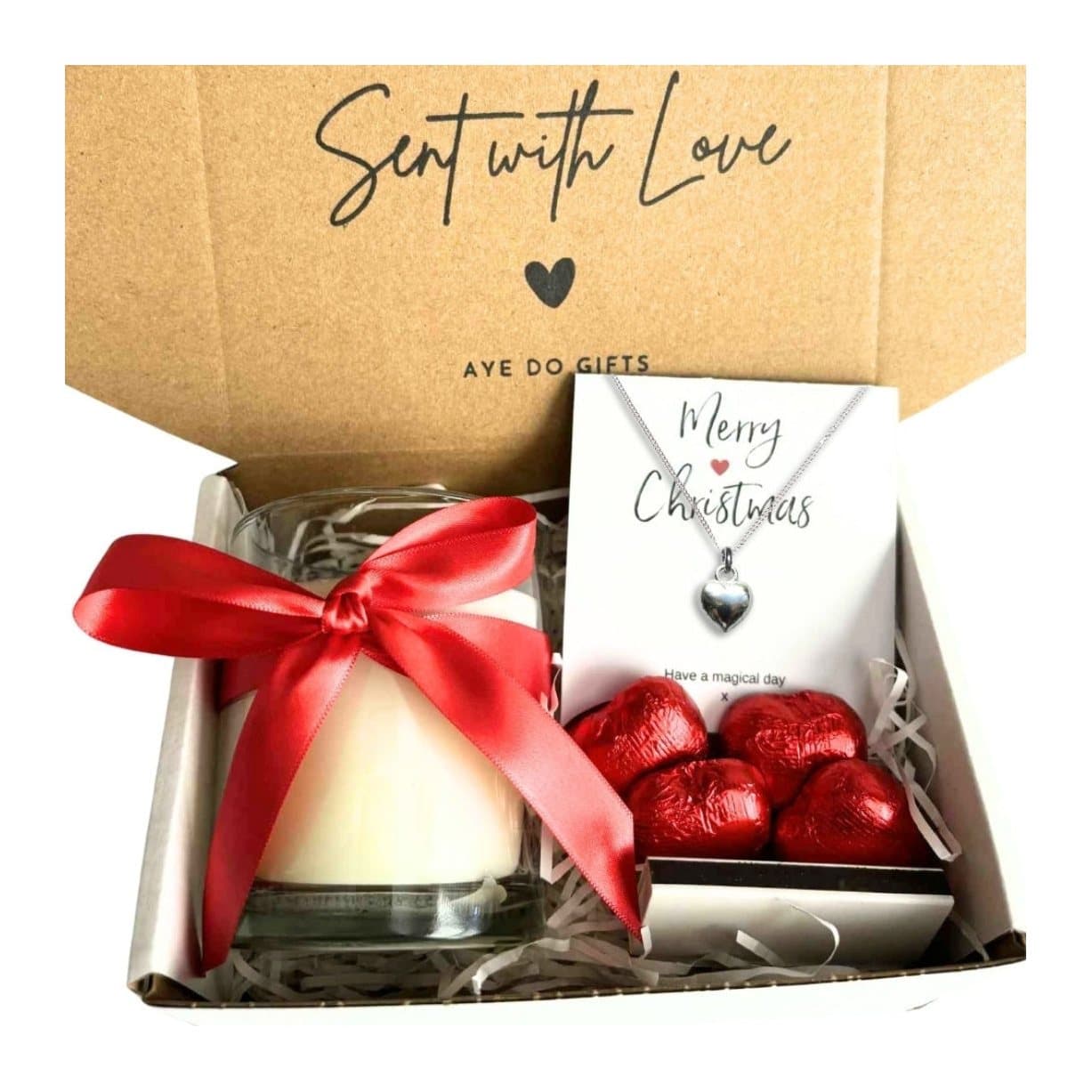 Christmas hamper with a heart necklace, vanilla candle and chocolate hearts