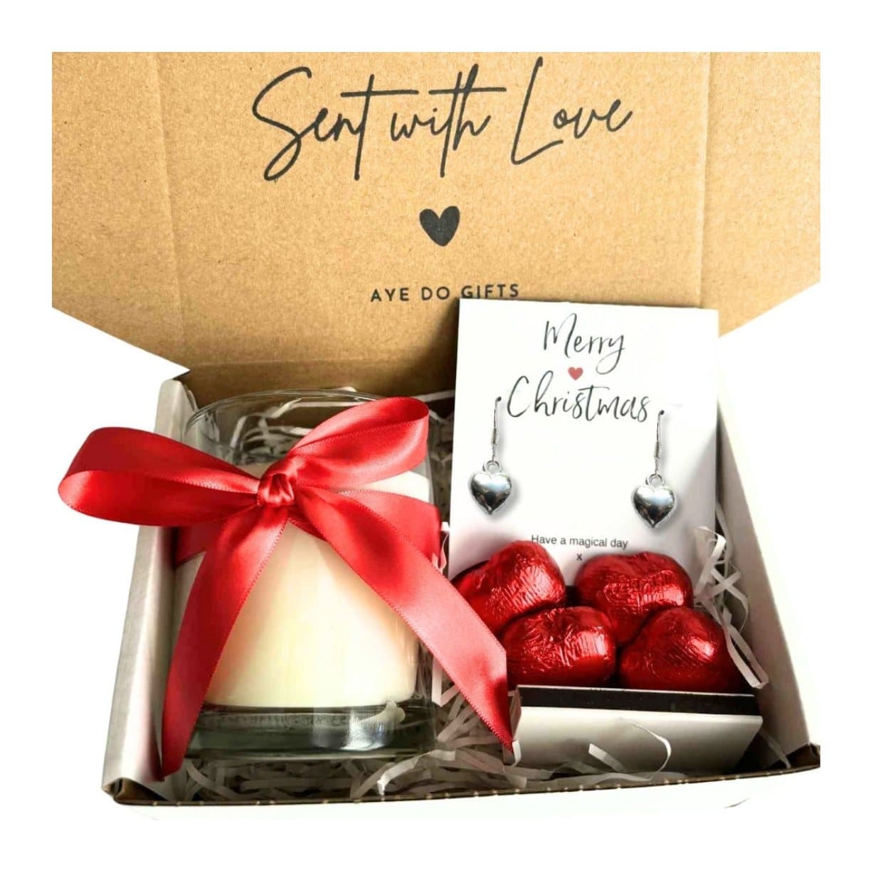 Christmas hamper with silver heart earrings, a vanilla candle and chocolate hearts
