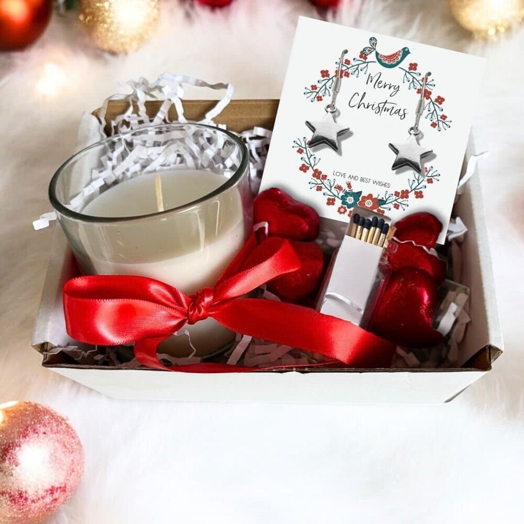 Christmas gift hamper with star earrings, a candle and milk chocolate hearts