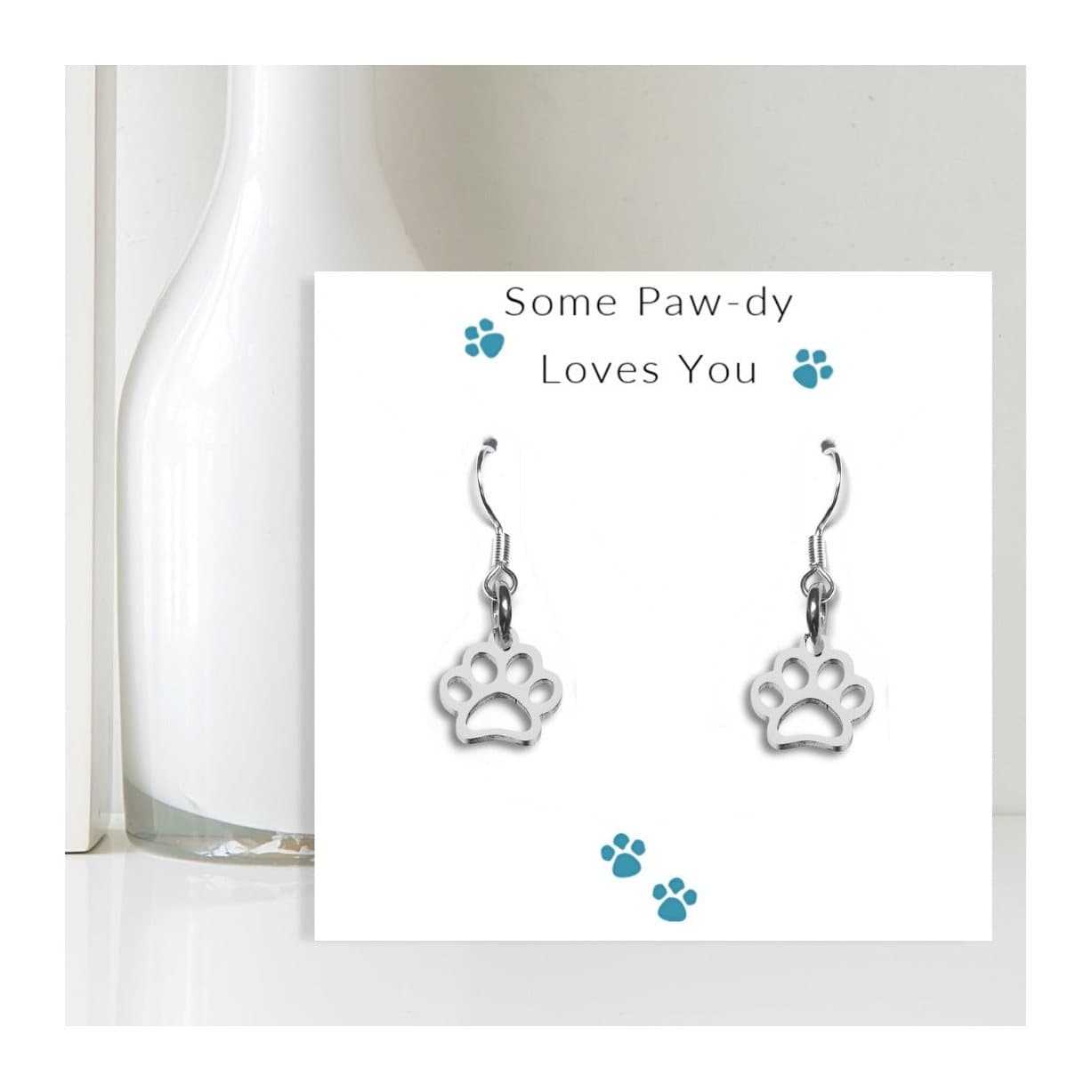 Paw print charm earrings with a Some Paw-dy Loves You message card