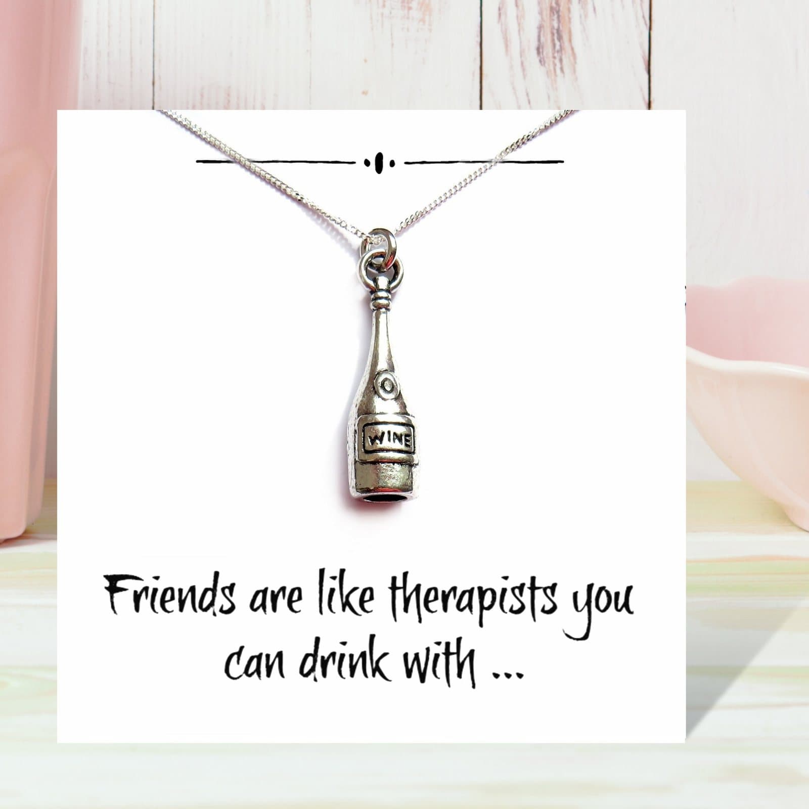 Wine bottle charm necklace on a funny friends message card